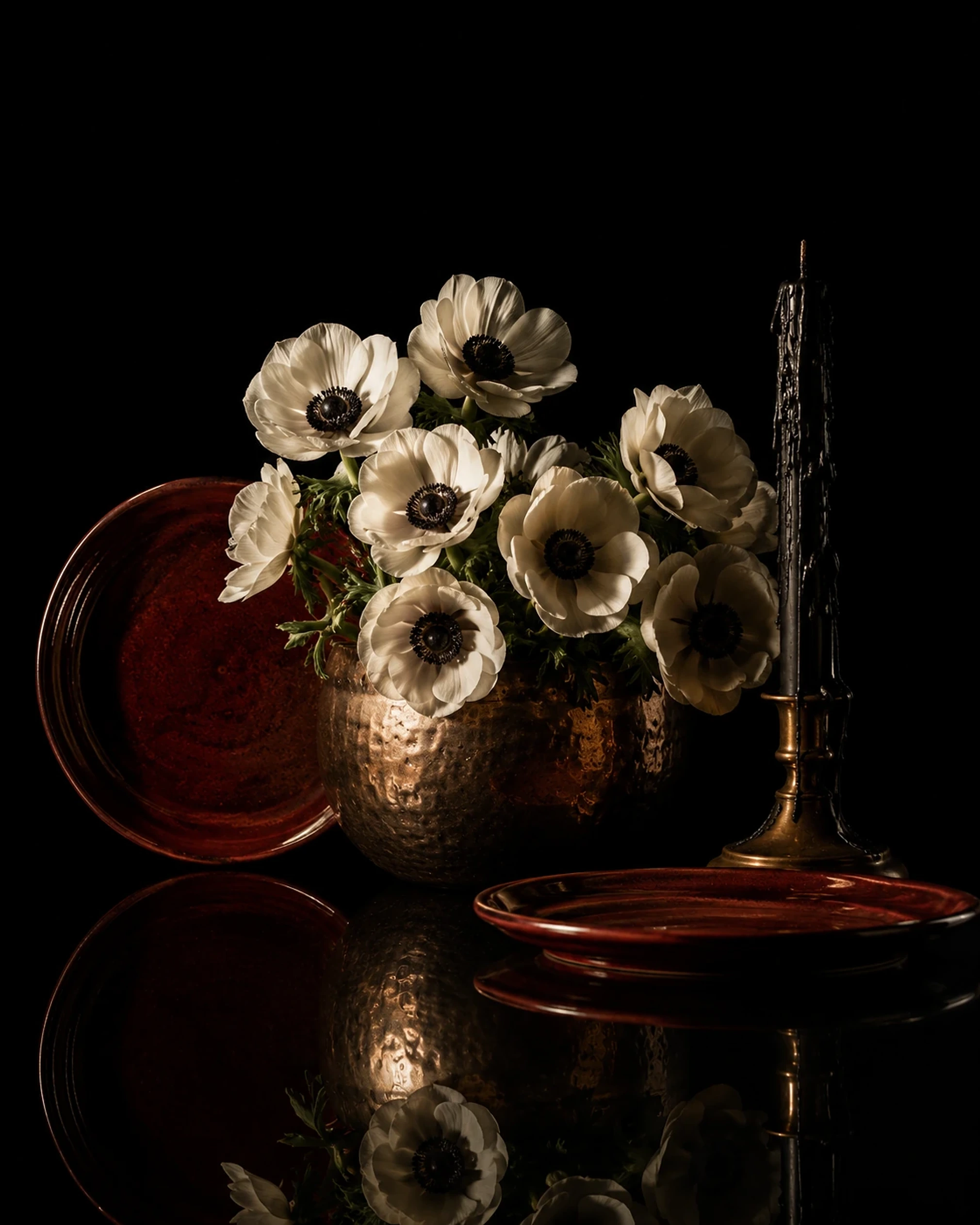 Gold table setting with floral arrangements for a private dinner
